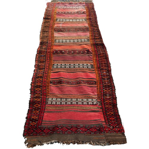 1761 - An old kilim runner with a striped central panel, 280cm x 80cm approximately together with another k... 