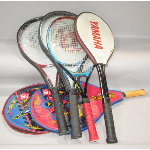 515 - Collection of sports and leisure equipment to include Grays hockey sticks, tennis and badminton racq... 