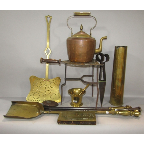 610 - A collection of mainly 19th century brass ware, including a pestle and mortar, fire irons, trivet, a... 