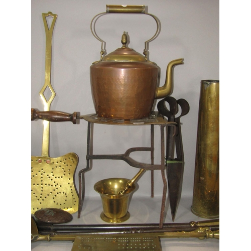 610 - A collection of mainly 19th century brass ware, including a pestle and mortar, fire irons, trivet, a... 