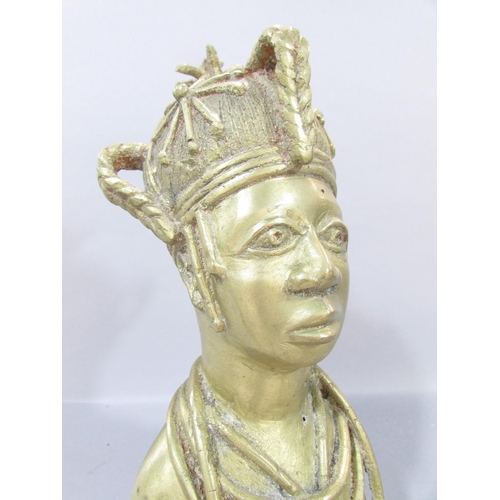 561 - A Benin cast metal bust of a man wearing a crown, an African wooden stool and carved wood African ma... 