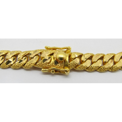 372 - Foreign 22ct curb link bracelet with bright-cut finish, clasp stamped '916', 19.8cm L approx excludi... 