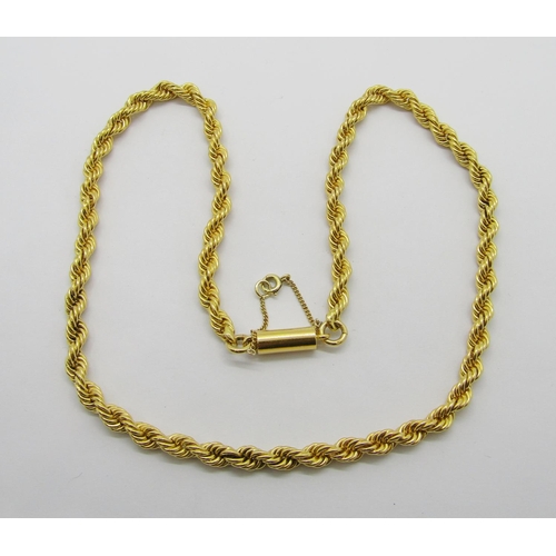 387 - Good quality yellow metal rope twist chain necklace with barrel clasp, indistinctly stamped, possibl... 