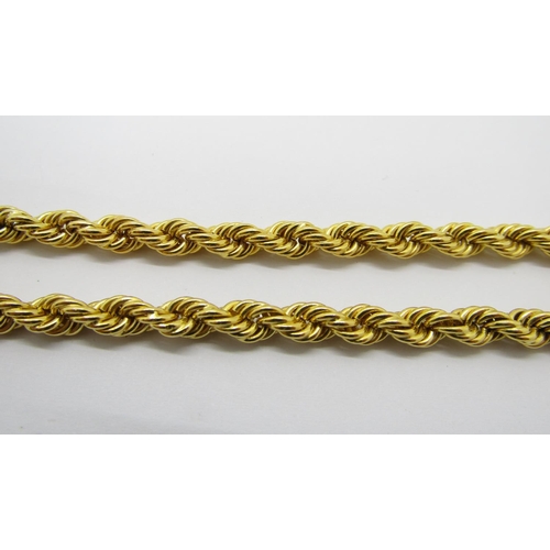 387 - Good quality yellow metal rope twist chain necklace with barrel clasp, indistinctly stamped, possibl... 