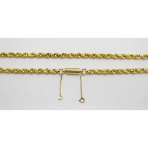 387 - Good quality yellow metal rope twist chain necklace with barrel clasp, indistinctly stamped, possibl... 