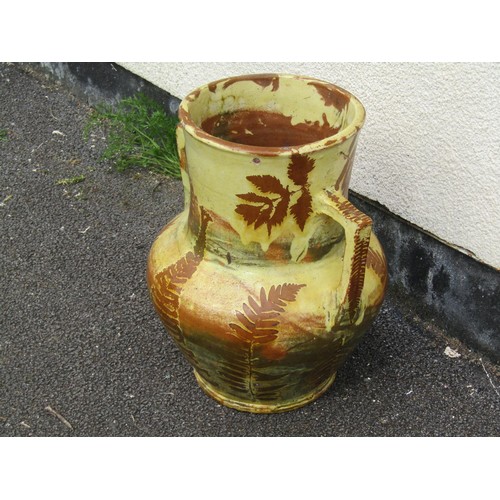 1699 - A slip glazed fern and landscape pattern earthen ware two handled vase, 41cm high