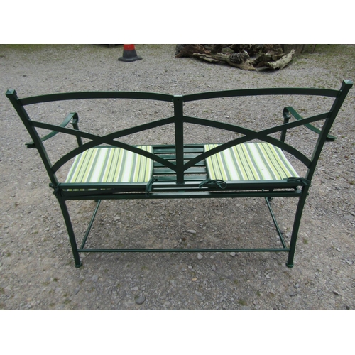 1037 - A Regency style green painted two-seat metal garden bench, with strap-work back, 91cm high, 115cm wi... 