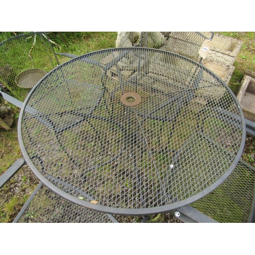 1059 - A weathered mat coated  steel garden terrace table with circular lattice/mesh panelled top, 107 cm d... 