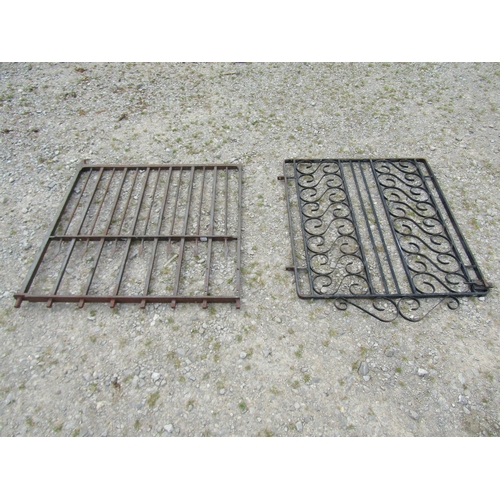 1078 - A heavy gauge ironwork garden gate, with open vertical rails, 94cm high, 96 wide together with one o... 