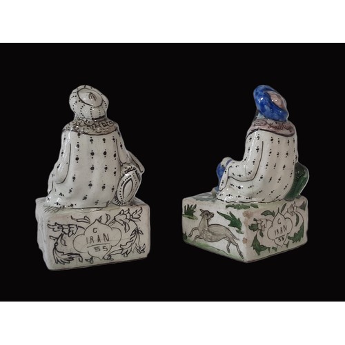 72 - A pair of Persian salt-glazed figural book ends