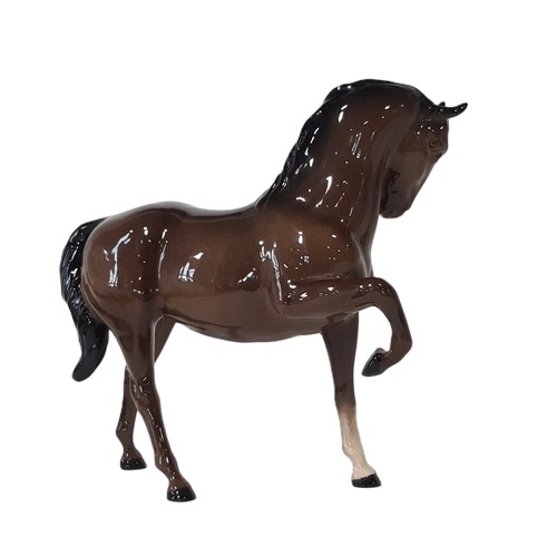 73 - A Beswick figure of a bay horse