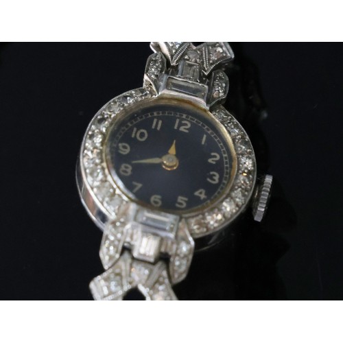 484 - A lady’s diamond set platinum cocktail wristwatch in the Art Deco style on later 9ct white gold stra... 