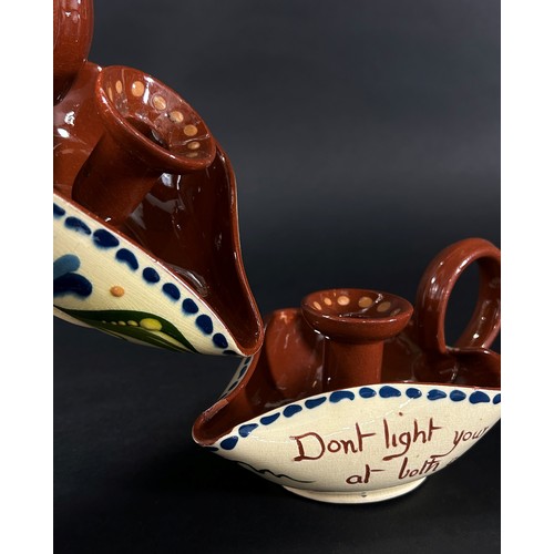 66 - A pair of Devon Motto ware chamber sticks, ‘Don’t Light Your Candle At Both Ends’ and ‘Be The Day We... 