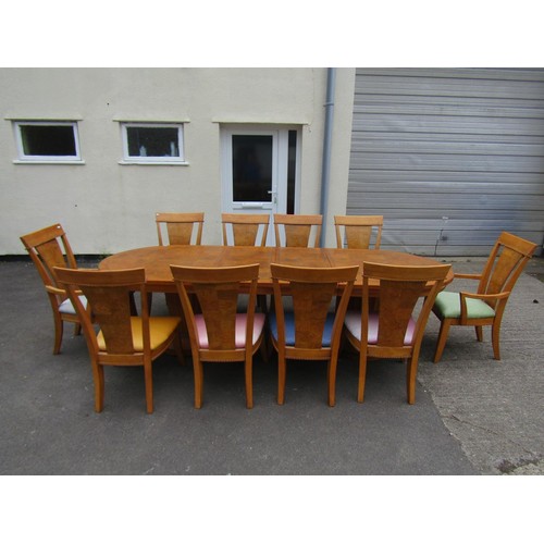 1719 - A good quality contemporary art deco style dining room suite comprising an oval extending twin flute... 