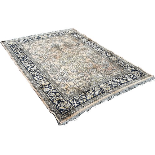 1796 - A Persian style carpet with exotic bird amongst flowers on a faded pink ground, 220cm 170cm approxim... 