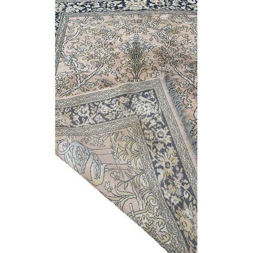 1796 - A Persian style carpet with exotic bird amongst flowers on a faded pink ground, 220cm 170cm approxim... 