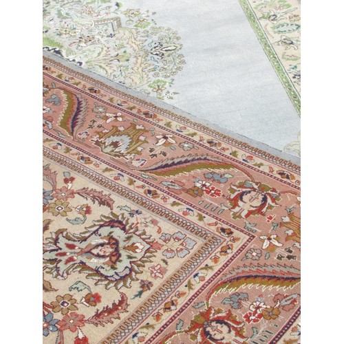 1787A - A good quality Tabriz carpet, purchased in Shiraz, Iran with a large central floral medallion on a p... 