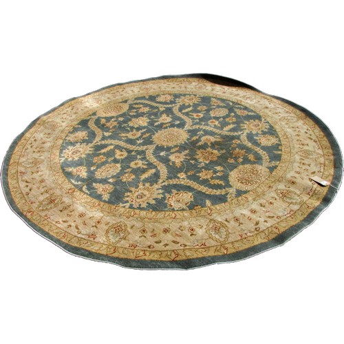 1795 - A circular Ziegler style carpet with trailing flowers on sage blue ground, 245cm diameter