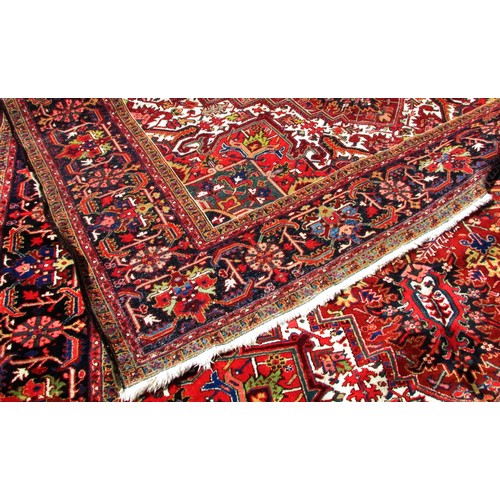 1793 - A good quality Heriz carpet, with an all over stylised floral and geometric pattern, 370cm x 270cm a... 