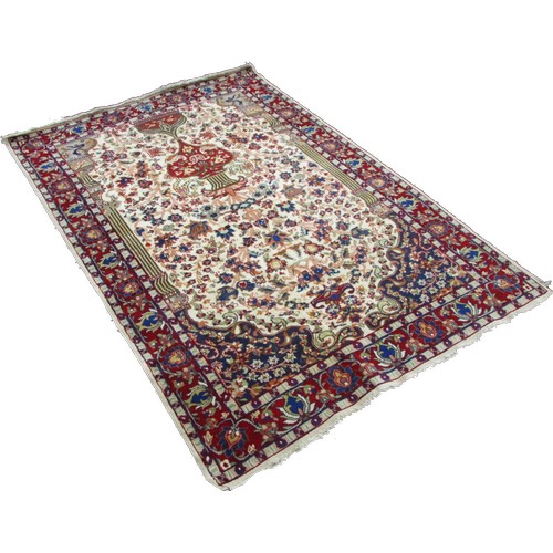 1786A - A Persian style wool rug with a tree of life type design and trailing floral borders 195cm x 120cm a... 