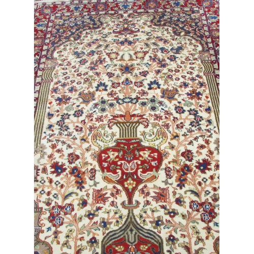 1786A - A Persian style wool rug with a tree of life type design and trailing floral borders 195cm x 120cm a... 