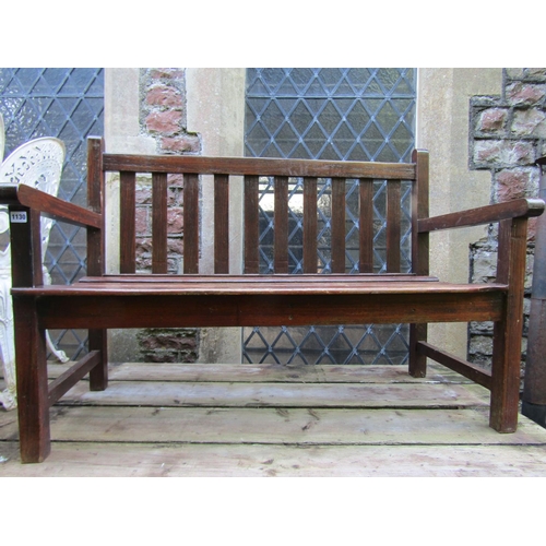 1130 - A small stained teak two seat garden bench with slatted seat and back, 120cm wide.