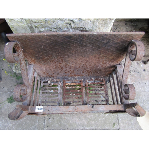 1160 - An old cast iron fire basket of rectangular form with open scroll detail and sabre finials 67 cm hig... 