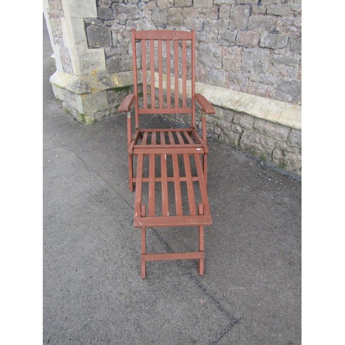 1173A - A contemporary stained hardwood folding steamer type chair with slatted seat, back and foot rest