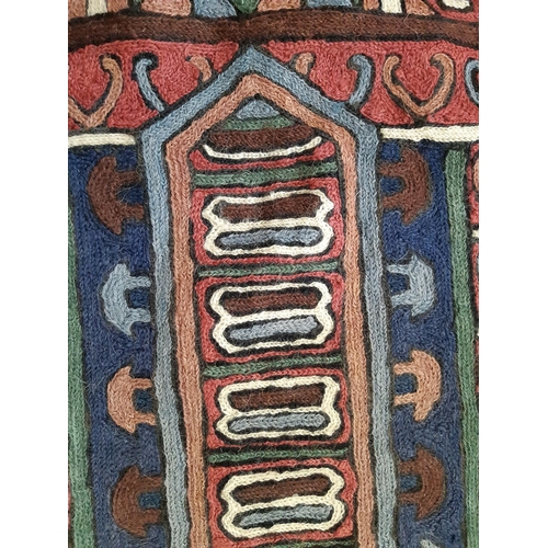 815 - Nepalese crewel work rug/ panel of colourful geometric design, backed with cotton fabric, 120x185cm ... 