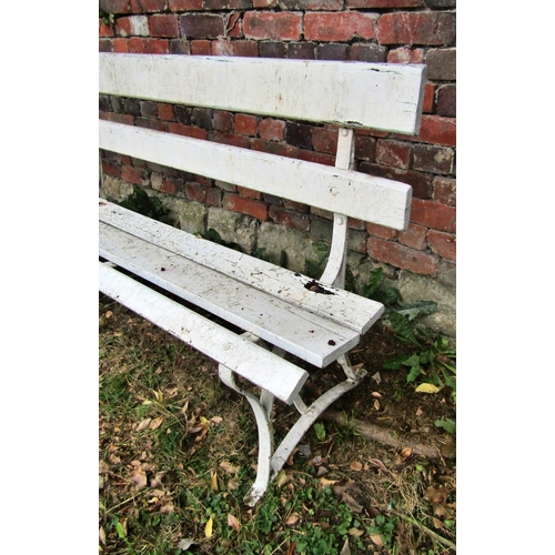 1166 - A vintage garden or park bench with painted timber slats raised on sprung steel supports, 244 cm (8f... 