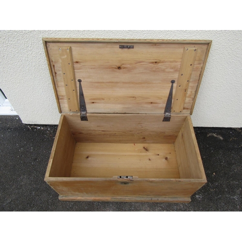 1683 - A stripped pine chest with hinged lid 39 cm high x 85 cm long x 47 cm