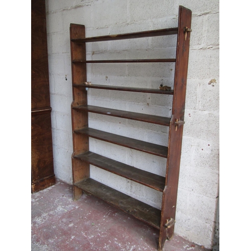 1694 - A vintage stained pine freestanding open bookcase with pegged framework, 186cm high x 125cm wide x 2... 