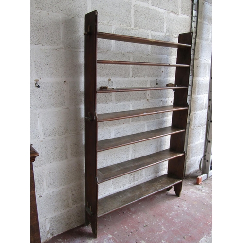 1694 - A vintage stained pine freestanding open bookcase with pegged framework, 186cm high x 125cm wide x 2... 