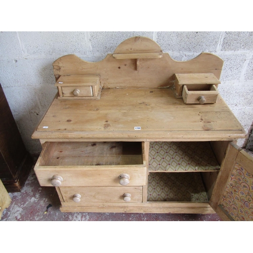 1700 - A small Victorian stripped pine dresser partially enclosed by a fielded panelled door and 3 long dra... 