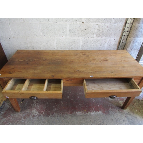 1702 - An old stripped pine kitchen dining table with two frieze drawers on square tapered supports, 76cm h... 