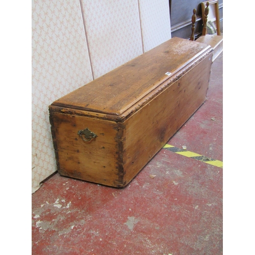 1703 - An unusual narrow old stripped pine blanket box with hinged lid and canted sides with exposed  dovet... 