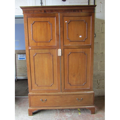 1727 - An Edwardian mahogany wardrobe in the Georgian style, enclosed by a pair of three quarter length mou... 