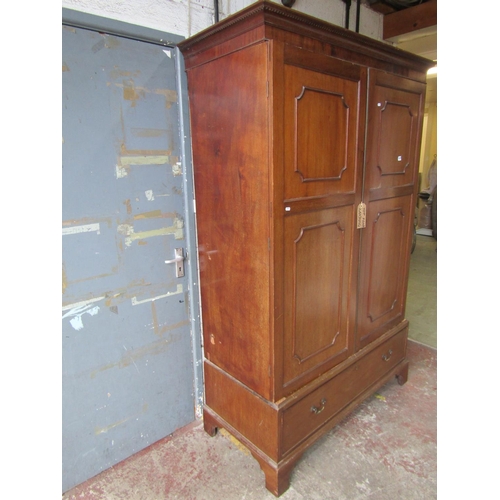 1727 - An Edwardian mahogany wardrobe in the Georgian style, enclosed by a pair of three quarter length mou... 