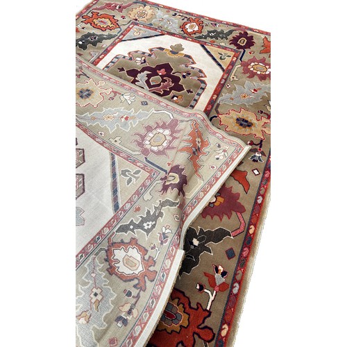 1762A - A modern machine made carpet by Delphi with a double stepped central medallions and a trailing flora... 