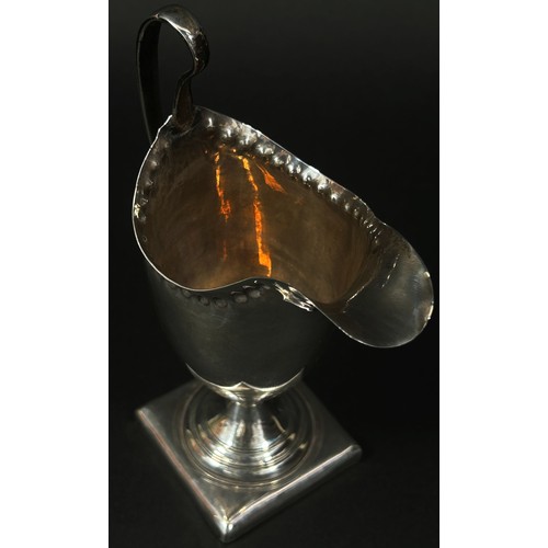 263 - A George III silver cream jug, London 1792, makers mark rubbed, 2.7oz