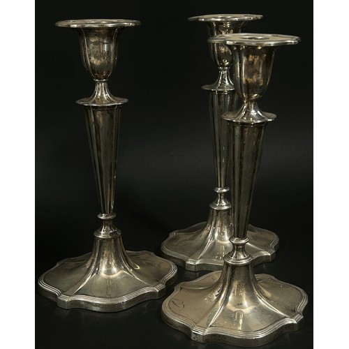 261A - Three Walker & Hall silver candlesticks on flared weighted bases, 24cm high