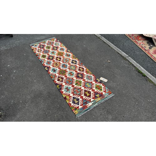 1785 - A small Chobi Kilim mat with an all over multicoloured geometric pattern 88 x 62cm