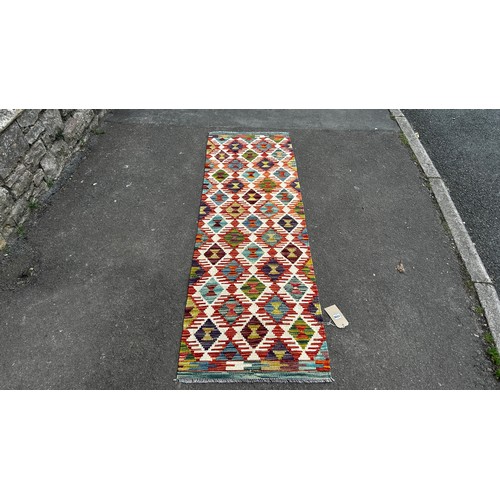 1785 - A small Chobi Kilim mat with an all over multicoloured geometric pattern 88 x 62cm