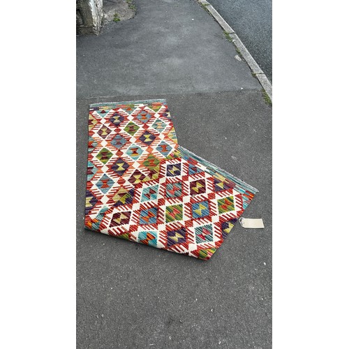 1785 - A small Chobi Kilim mat with an all over multicoloured geometric pattern 88 x 62cm