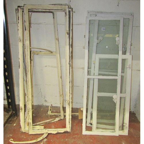 1668 - Architectural salvage: A group of Georgian reclaimed iron window frames, the largest glazed example ... 