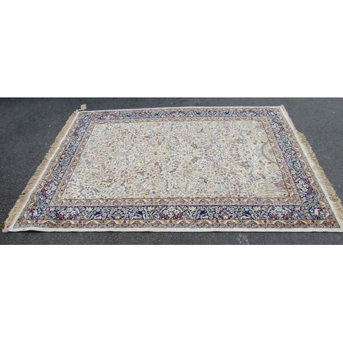 1777A - A Persian style carpet with an all over floral pattern on a cream ground 225cm x 153cm approximately