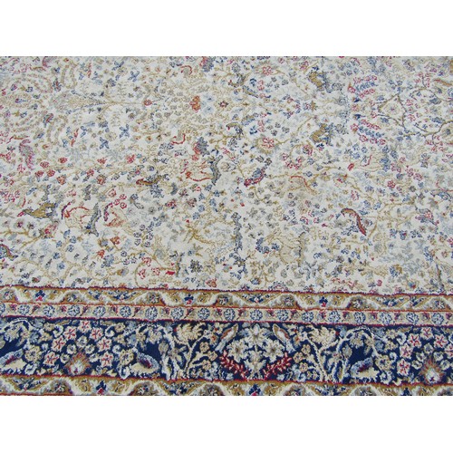 1777A - A Persian style carpet with an all over floral pattern on a cream ground 225cm x 153cm approximately