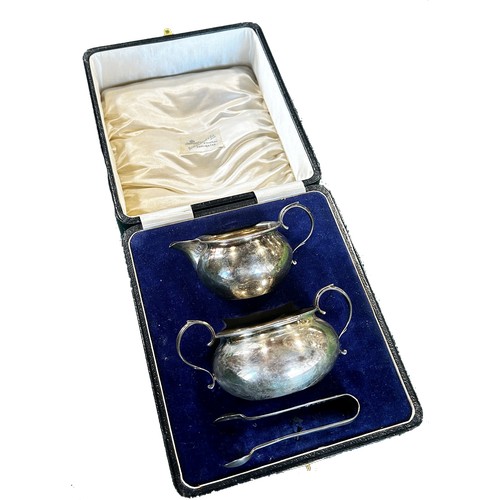 254 - A cased silver sugar bowl, jug and tong, a cased condiment set, a ladle, salt and pepper pots, a cas... 