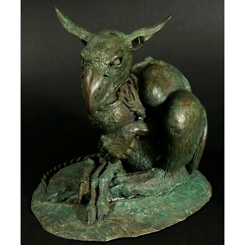 551 - A cast bronze grotesque Gothic nightmare creature tethered with a collar and rope, signed C Daniel t... 