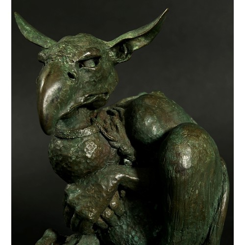 551 - A cast bronze grotesque Gothic nightmare creature tethered with a collar and rope, signed C Daniel t... 